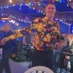 Bill wearing bright shirt with christmas lights patern